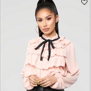 Pretty pink ruffle blouse from Fashion Nova.